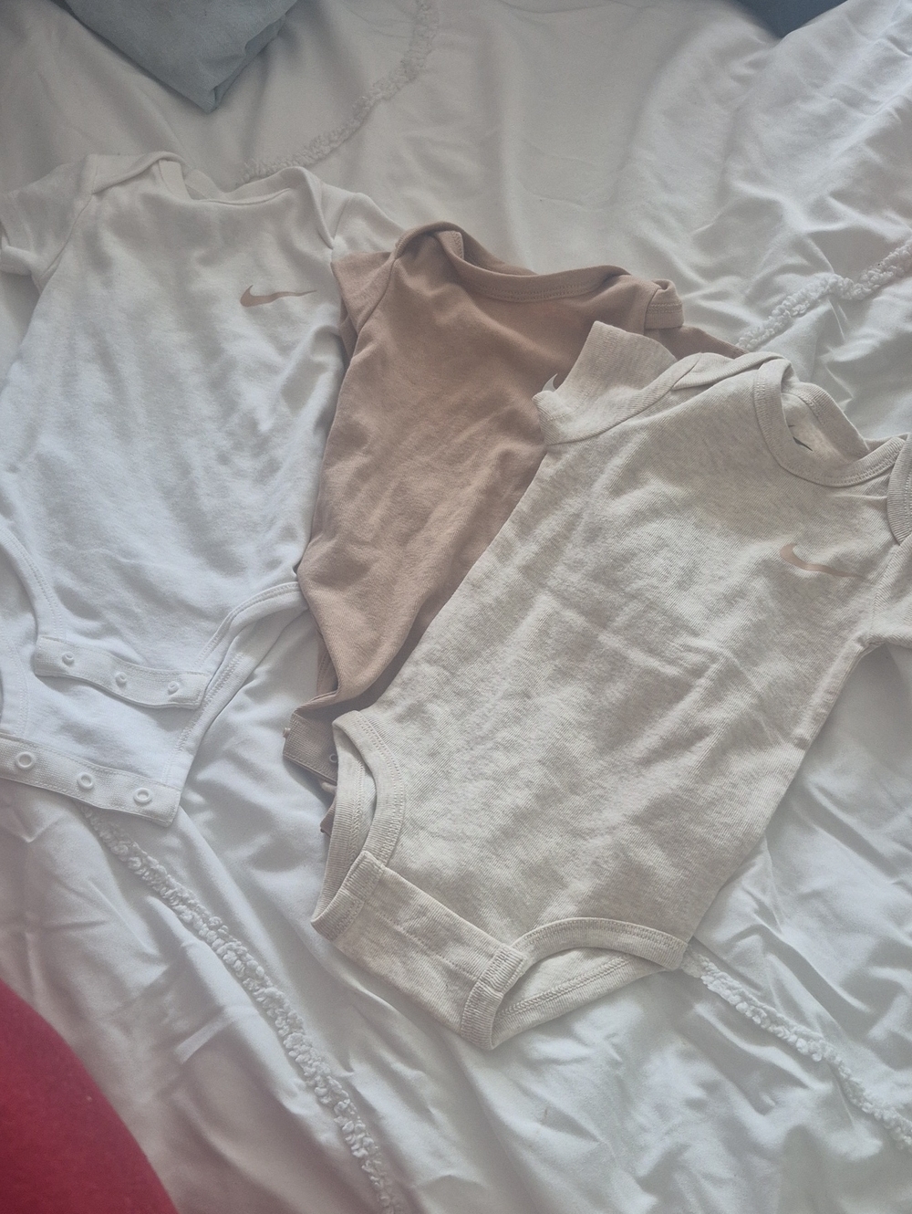 Nike Kids One-Piece Bodysuits in White, Beige, and Tan - Trio Pack